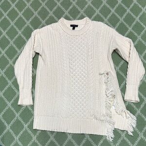 J Crew cream colored sweater with playful slit with fringe.